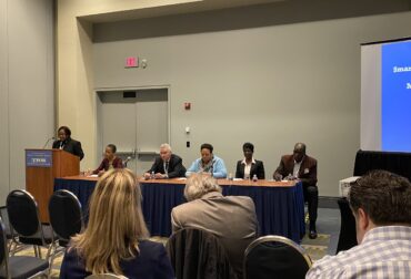Panel of speakers presenting at an MWDBE compliance session