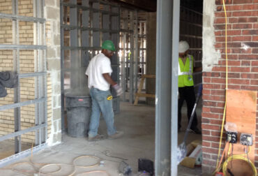Construction worker in a safety vest at a building site