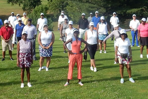 Golfers standing on the greens